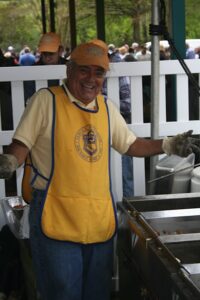 Norfolk Sertoma mans the grill station at the Spring Fever event