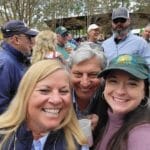 People smiling at an event